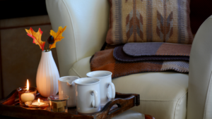 Comfy chair with tea and flowers on a tray